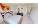 Bedroom with ensuite bath access and dresser with mirrors at 18954 Ayrshire Cir, Port Charlotte, FL 33948