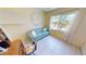 Guest room featuring a sofa and bright windows with exterior view at 18954 Ayrshire Cir, Port Charlotte, FL 33948