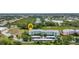 Scenic aerial shot of an apartment complex, highlighting its lush landscaping, parking and prime location near a pond at 2020 Willow Hammock Cir # 302, Punta Gorda, FL 33983