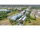 Beautiful aerial view of a condo complex, showing its well-kept grounds, parking, and access to a serene lake at 2020 Willow Hammock Cir # 302, Punta Gorda, FL 33983