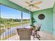Relaxing screened balcony with ceiling fan, outdoor furniture, and tranquil water view at 2020 Willow Hammock Cir # 302, Punta Gorda, FL 33983