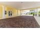 Clubhouse entrance with brick pavers, white columns, and a covered entrance at 2020 Willow Hammock Cir # 302, Punta Gorda, FL 33983