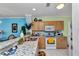Bright kitchen boasts granite countertops, stainless steel sink, and natural wood cabinets at 2020 Willow Hammock Cir # 302, Punta Gorda, FL 33983