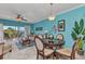 Open concept living and dining area with modern ceiling fan and access to the lanai with relaxing views at 2020 Willow Hammock Cir # 302, Punta Gorda, FL 33983