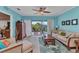 Comfortable living room with natural light, ceiling fan and access to the lanai make this space inviting at 2020 Willow Hammock Cir # 302, Punta Gorda, FL 33983