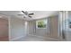 Comfortable bedroom with neutral paint, tile floors, ceiling fan and window views at 20215 Macon Ln, Port Charlotte, FL 33952
