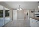 Spacious dining area with tile flooring, modern lighting and convenient access to the outdoor patio at 20215 Macon Ln, Port Charlotte, FL 33952