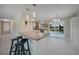 Bright kitchen with granite countertops and seating, complemented by a view of the lanai at 20215 Macon Ln, Port Charlotte, FL 33952