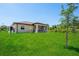 Expansive backyard features a lush lawn and a screened patio perfect for outdoor enjoyment at 2186 Florala St, North Port, FL 34287