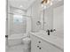 Bright bathroom features a modern vanity with marble countertop and tile backsplash at 2186 Florala St, North Port, FL 34287