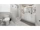 Modern bathroom featuring a double vanity, a stylish tiled shower, and contemporary fixtures at 2186 Florala St, North Port, FL 34287
