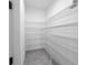 Walk-in pantry with metal shelving for optimal storage in a light and bright room at 2186 Florala St, North Port, FL 34287