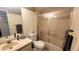 Bathroom features sink, toilet, and shower with sliding glass doors at 2275 S Mccall Rd # 103, Englewood, FL 34224