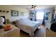 Calm bedroom featuring natural light, a comfortable bed, and stylish décor for relaxing and peaceful nights at 2275 S Mccall Rd # 103, Englewood, FL 34224