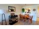 Charming dining area with a wooden table, comfortable seating, and stylish décor for Gathering meals and gatherings at 2275 S Mccall Rd # 103, Englewood, FL 34224