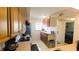Well-designed kitchen featuring ample counter space, modern appliances, and convenient access to the adjacent rooms at 2275 S Mccall Rd # 103, Englewood, FL 34224