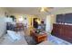 Cozy living room featuring comfortable seating, a functional workspace, and seamless flow into the adjacent dining area at 2275 S Mccall Rd # 103, Englewood, FL 34224
