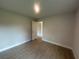 Empty bedroom with tile flooring, neutral walls, and natural light, ready for personalization at 23245 Jules Ave, Port Charlotte, FL 33980