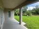 Covered patio with a tranquil view, ideal for outdoor relaxation and entertainment at 23245 Jules Ave, Port Charlotte, FL 33980