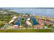 An aerial view showcasing waterfront condos, private boat docks, and lush landscaping at 25188 Marion Ave # 10, Punta Gorda, FL 33950