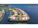 Aerial view of waterfront homes, boat docks, and private pools in a canal-lined community at 25188 Marion Ave # 10, Punta Gorda, FL 33950
