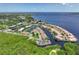 Aerial view of waterfront properties, boat docks, and surrounding waterway landscape at 25188 Marion Ave # 10, Punta Gorda, FL 33950