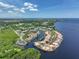 Wide aerial shot showcases the neighborhood layout, waterfront properties, and community access at 25188 Marion Ave # 10, Punta Gorda, FL 33950