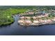 Aerial view of waterfront homes with private docks and community canal access at 25188 Marion Ave # 10, Punta Gorda, FL 33950