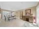 Welcoming dining area featuring tile flooring, a modern light fixture, and ample natural light at 25188 Marion Ave # 10, Punta Gorda, FL 33950