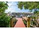 Beautiful wooden dock with views of boats and waterfront residences along the canal at 25188 Marion Ave # 10, Punta Gorda, FL 33950