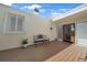 Inviting deck area with outdoor seating, plants and a view of the surrounding landscape at 25188 Marion Ave # 10, Punta Gorda, FL 33950