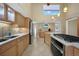Bright kitchen boasts stainless steel appliances, double sink, and gas range at 25188 Marion Ave # 10, Punta Gorda, FL 33950
