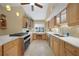 Modern kitchen showcasing granite countertops, stainless steel appliances, and ample cabinet space at 25188 Marion Ave # 10, Punta Gorda, FL 33950