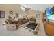 Beautiful living room featuring vaulted ceilings, tile floors, and comfortable seating at 25188 Marion Ave # 10, Punta Gorda, FL 33950