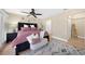 Bedroom with area rug, ceiling fan, and ensuite bathroom at 25188 Marion Ave # 10, Punta Gorda, FL 33950