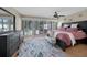 Main bedroom featuring a rug, and an exit to the pool area at 25188 Marion Ave # 10, Punta Gorda, FL 33950
