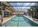 Enclosed pool with a large deck area, perfect for outdoor entertaining and relaxation at 25188 Marion Ave # 10, Punta Gorda, FL 33950