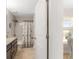 Bathroom with granite countertop vanity, shower-tub combo with decorative curtain, and tiled flooring at 27147 Guapore Dr, Punta Gorda, FL 33983