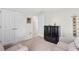 Bright bedroom with two sofas, closet, and decorative art at 27147 Guapore Dr, Punta Gorda, FL 33983