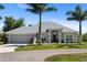 Charming single story home featuring beautiful landscaping and a two-car garage at 27147 Guapore Dr, Punta Gorda, FL 33983