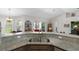 Kitchen counter features granite countertops, stainless steel sink, and view of the screened-in porch at 27147 Guapore Dr, Punta Gorda, FL 33983