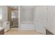 Bright main bathroom features tile floors, double vanity, a shower and a soaking tub at 27147 Guapore Dr, Punta Gorda, FL 33983
