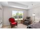 Main bedroom featuring neutral walls, sitting area and large windows for natural light at 27147 Guapore Dr, Punta Gorda, FL 33983