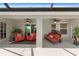 Covered patio includes two separate seating areas, each with ceiling fans, providing a perfect outdoor relaxation spot at 27147 Guapore Dr, Punta Gorda, FL 33983