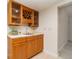 The bar area features wooden cabinets and a dedicated wine rack for storage at 283 Fields Se Ter, Port Charlotte, FL 33952