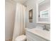 Cozy bathroom featuring a white vanity, a shower, and neutral wall colors at 283 Fields Se Ter, Port Charlotte, FL 33952