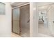 Bathroom features a glass enclosed shower and easy access to the main bedroom at 283 Fields Se Ter, Port Charlotte, FL 33952