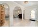 Welcoming entryway with arched doorways, tile flooring, and views into the adjacent living spaces at 283 Fields Se Ter, Port Charlotte, FL 33952