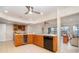 Bright kitchen boasts wooden cabinets, white countertops, and modern stainless steel appliances at 283 Fields Se Ter, Port Charlotte, FL 33952