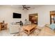Spacious living room with comfortable seating, a modern entertainment system, and lots of natural light at 283 Fields Se Ter, Port Charlotte, FL 33952